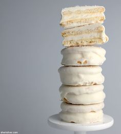 a stack of four doughnuts sitting on top of each other with the words fitz cracker moon pies above them