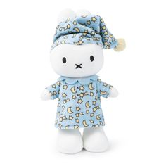 a small stuffed animal wearing a blue and yellow outfit with stars on it's head