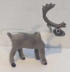 a toy deer with antlers on it's back