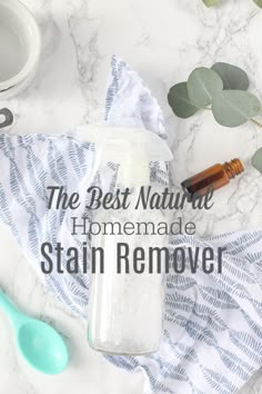 the best natural homemade stain remover on a marble counter top with eucalyptus leaves and spoons