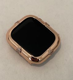 Fits the Apple Watch available for sizes 40 and 44mm in series 4,5,6 or SE. Iwatch Band Custom Bezel with Lab Diamonds Micro Pave in 14k rose gold plating. Custom plated in 14k Rose Gold and set with high quality lab diamonds. Snap closure, easy to get on and off. Access to all button. For band