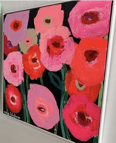 an abstract painting of pink and red flowers