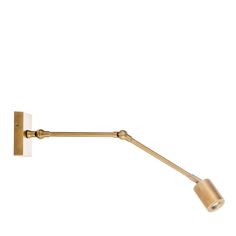 a gold wall light with a white background