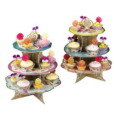 three tiered trays with cupcakes on them