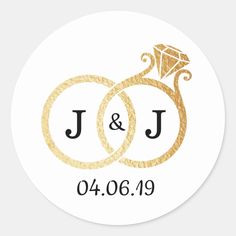 wedding stickers with gold rings and diamond on the middle, in black ink that says j & j