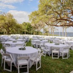 tables and chairs are set up in the grass