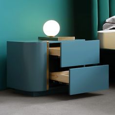 a night stand with two drawers and a light on top