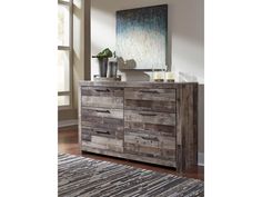 a large wooden dresser sitting on top of a hard wood floor