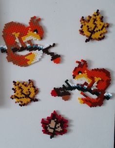 several pixel art pieces are arranged on a table