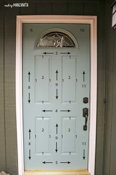 the front door is painted blue and has arrows pointing in different directions to make it look like