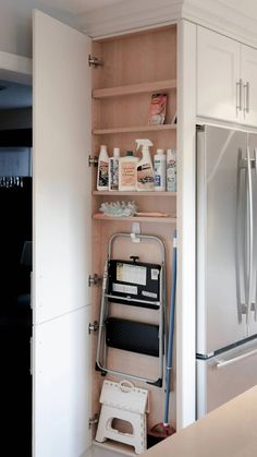 the kitchen is clean and ready to be used as a storage area for cleaning supplies