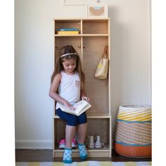 The Learn 'N Store Cubby by Little Partners® is a multi-purpose storage solution designed to aid in teaching young kids organizational skills. Offering cubbies, shelves, and 8 hanging hooks, the Learn 'N Store Cubby simplifies the home. It provides all the nooks and crannies needed to help kids neatly store shoes, jackets, backpacks, and supplies. A small ledge provides a space to sit while putting on or removing shoes, encouraging kids to learn routines whenever they are heading out to their ne