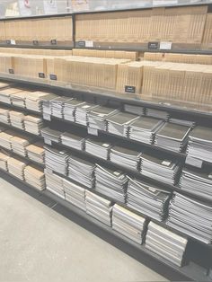 several stacks of metal sheets in a warehouse