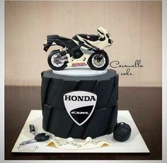 a motorcycle cake is sitting on a table