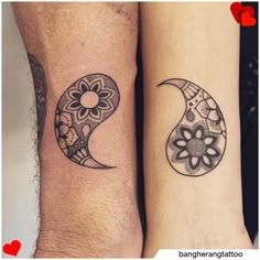 two people with matching tattoos on their arms, one has a crescent and the other has a flower