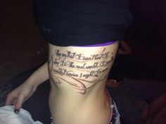 a woman's lower leg with words written on it