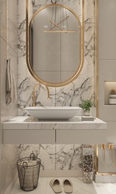 a bathroom with marble and gold accents