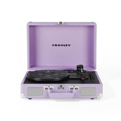 the crosley suitcase record player is purple and has wheels on each side that are black