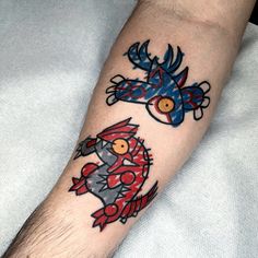 an arm with two cartoon characters on it