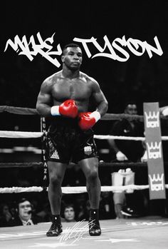 a black and white photo of a man with boxing gloves