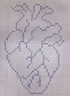 a cross - stitch pattern is shown on a piece of paper