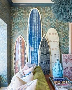 a living room with surfboards on the wall