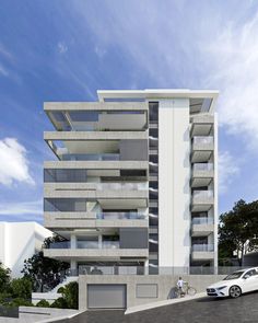 an artist's rendering of a modern apartment building with balconies and garages