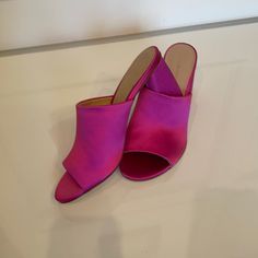 Fuchsia Satin Slides That Are New Without Tagsnever Worn In Perfect Condition! Luxury Pink Pointed Toe Mules, Elegant Pink Mules With Sculpted Heel, Pink Mules With Sculpted Heel For Party, Luxury Pink Open Heel Mules, Pink Mules With 4-inch Heel For Party, Pink Evening Mules With Padded Heel, Pink Mules With 4-inch Heel And Open Heel, Pink Mules With 4-inch Open Heel, Chic Pink Mules With 4-inch Heel