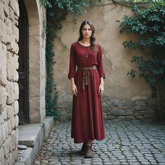 This rust red Viking-inspired dress blends historical charm with modern comfort. Perfect for medieval reenactments, Renaissance fairs, or Nordic-themed festivals, this gown features a simple yet elegant design, complete with a tied belt for a flattering fit. The deep red color adds warmth and authenticity, making it a versatile choice for historical events or cosplay. Whether you're walking through a festival or stepping into character for a reenactment, this dress offers both style and practicality. Its timeless design makes it a must-have for anyone seeking a piece of history in their wardrobe. I hope you will love my design as much as I enjoyed creating it for you! ----Important Information---- Please, be aware that all pictures are designer's illustrations. The actual product may sligh Red Viking Dress, Viking Dress Medieval Collectibles, Viking Fashion History, Linen Viking Dress, Historically Accurate Viking Clothing, Dress Medieval, Viking Dress, Deep Red Color, Medieval Dress