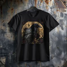 🖤🌹 Unravel the mystery with our Raven's Black T-Shirt! 🦇👕 Our intriguing t-shirt features our captivating design of a beautiful raven perched in a Gothic garden, surrounded by lush, dark red roses. The stark contrast between the raven's dark silhouette and the deep red of the roses creates a striking and enigmatic visual. The Gothic garden setting adds a layer of mystique and romance, making this shirt a perfect choice for those who love the blend of nature's dark beauty and Gothic aesthetics. Whether for casual outings or as a statement piece, this t-shirt is sure to turn heads and spark imagination This just might be the softest and most comfortable women's t-shirt you'll ever own. Combine the relaxed fit and smooth fabric of this tee with jeans to create an effortless every-day outf Black Grunge T-shirt For Fall, Black Short Sleeve Grunge T-shirt, Gothic Black T-shirt For Halloween, Punk Style Black Top For Halloween, Gothic Short Sleeve T-shirt For Halloween, Black Graphic Tee For Alternative Fashion, Black Punk T-shirt For Fall, Gothic Black Streetwear Tops, Black Gothic T-shirt For Streetwear