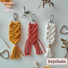 crochet keychains with different colors and designs on them, sitting next to each other