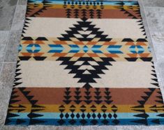 a multicolored area rug on the floor