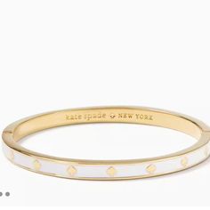 Brand New With Tags Kate Spade Spot The Spade Enamel Hinged Bangle Measurements Accessory Length (In): 2.25 In Band Width (In): 2.13 In Product Weight: 23.7g Inner Circumference: 2.25" Features Hinge With Push-Clasp Closure Plated Metal Polished Gold Colors: White, And Gold Gorgeous Kate Spade Bangle Bracelet, Bday Wishlist, Kate Spade Bracelet, Jewelry Wishlist, Kate Spade Bangle, Bracelet Stacks, Kids Accessories Jewelry, Xmas List, White Bracelets