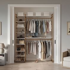 an open closet with clothes and shoes hanging on the shelves, next to a couch