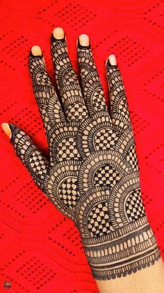 a henna tattoo on someone's hand