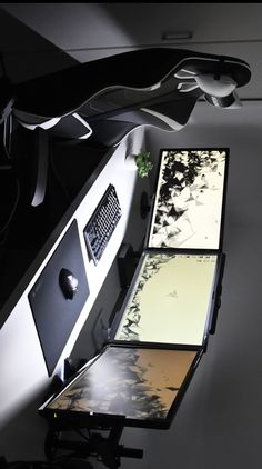 an image of a computer desk with two monitors on it