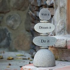 rocks stacked on top of each other with the words wish it dream it do it