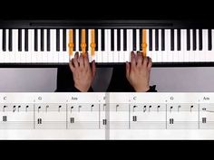 someone is playing the piano with their hands and fingers on top of each other's keys