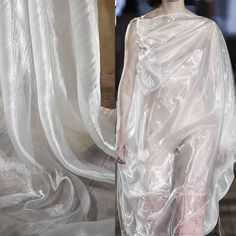 a woman wearing a white dress with sheer fabric on the top and bottom, next to an image of a mannequin draped over her head