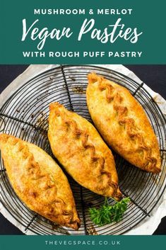 two pastries sitting on top of a wire rack with the words, mushroom and merlot vegan pasties with rough puff pastry