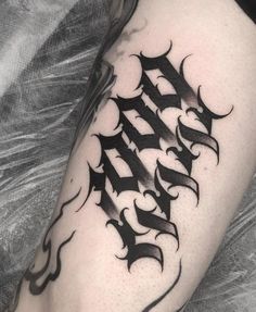 a black and white photo of a tattoo on someone's leg with the word faith written in cursive font