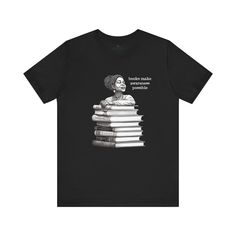 Immerse yourself in the world of wisdom with our Black Woman Reading Books Tee Shirt, a symbol of tranquility and intellectual curiosity. Artfully illustrated with a striking black and white line drawing, the shirt depicts an African American woman in a moment of serene, peaceful contentment, resting atop a pile of books that represents the foundation of her knowledge. The Black Woman Reading Books Tee Shirt ignites a love for learning in everyone who wears it. It's more than just clothing; it's Black Woman Reading, American Student, Power Of Education, Heather Storm, Books To Read For Women, Pile Of Books, Culture Club, Black And White Lines, Woman Reading