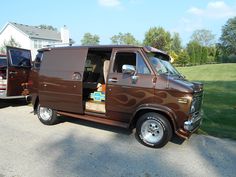 a brown van parked in front of a house