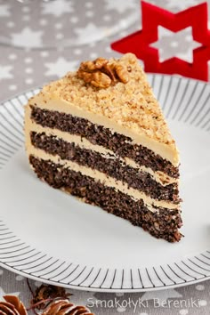 a piece of cake on a plate with nuts around it and a star in the background