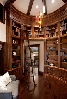 a room with bookshelves and a ladder in the middle is featured on instagram