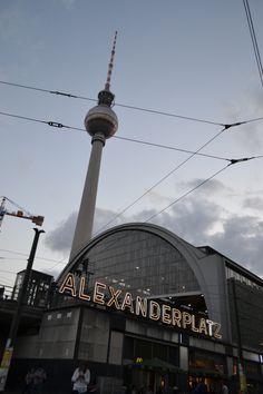 a tall building with a sign that says alexandriaplat on it's side