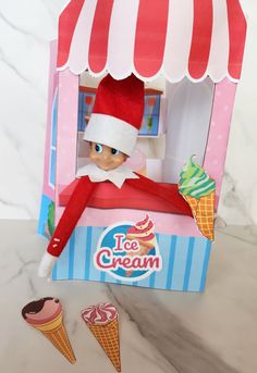 an elf is sitting in a ice cream carton