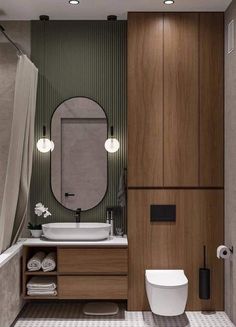 a bathroom with a toilet, sink and mirror