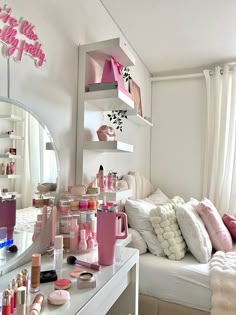 a room filled with lots of makeup and personal care items on top of a white table