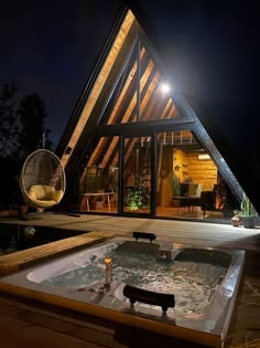 a large hot tub sitting inside of a wooden building